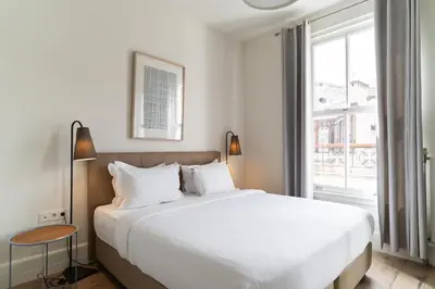a bedroom with a large white bed and a window at Casa Di Bava Suites by TCH in Istanbul