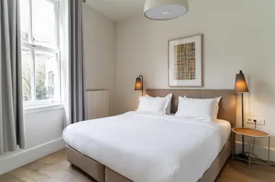 a bedroom with a large white bed and a window at Casa Di Bava Suites by TCH in Istanbul