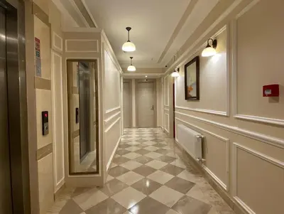 a hallway with a tile floor in a building at Hotel Mavirem in Istanbul