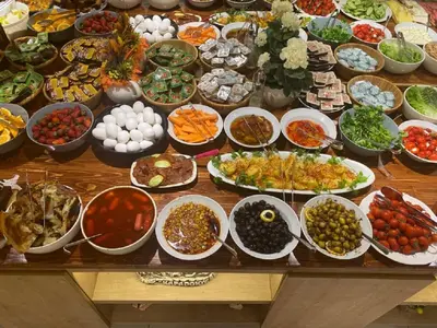 a table with many bowls of different types of food at Hotel Mavirem in Istanbul