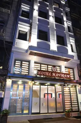 a store front of a building at night at Hotel Mavirem in Istanbul