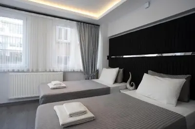 a hotel room with two beds with towels on them at Carvan HOTEL in Istanbul