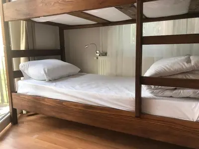 a bedroom with two bunk beds with white pillows at Kalkedon Plus in Istanbul