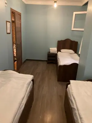 a small room with two beds and a mirror at Ulusoy Old Cıty in Istanbul