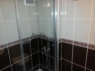 a shower with a glass door in a bathroom at Avlonya Hotel in Istanbul