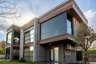 an office building with glass windows at Andalus Villas NO ALCOHOL ALLOWED with Heated Pool in Sapanca