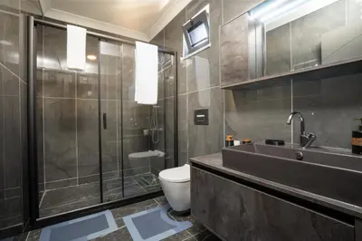 a bathroom with a toilet and a sink and a shower at Andalus Villas NO ALCOHOL ALLOWED with Heated Pool in Sapanca