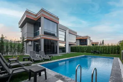 an exterior view of a house with a swimming pool at Andalus Villas NO ALCOHOL ALLOWED with Heated Pool in Sapanca