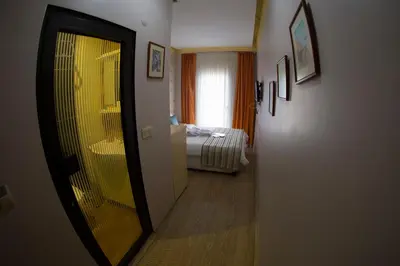 a hallway of a hotel room with a bedroom at Ottoman Time Hotel in Istanbul