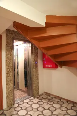 a staircase in a hotel lobby with a mirror at Ottoman Time Hotel in Istanbul