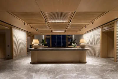 a lobby with a reception desk in a building at İnemare Hotel in Demirköy