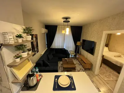 a living room with a couch and a bed at Classic Suite MK1 in Istanbul