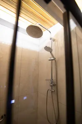 a shower in a bathroom with a shower head at Villa Nora Butik Otel ve Bungalov in Bursa