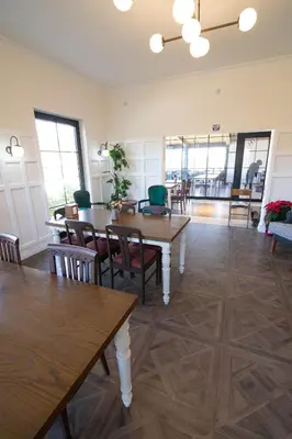 a dining room with wooden tables and chairs at Villa Nora Butik Otel ve Bungalov in Bursa