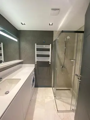 a bathroom with a shower and a sink at Luxury Central Fully Equipped 2BR 2BA Apartment by Siena Suites in Istanbul
