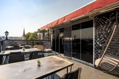 a patio with a table and chairs on a balcony at York House İstanbul in Istanbul