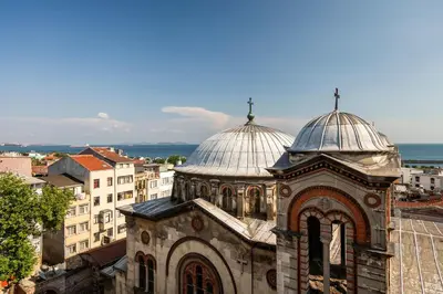 an old building with two domes on top of it at York House İstanbul in Istanbul