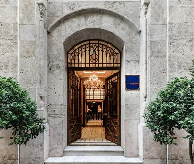 an entrance to a building with a chandelier at Cronton Design Hotel in Istanbul