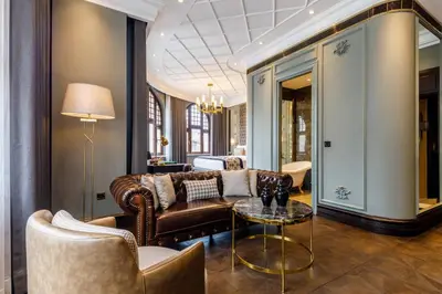 a living room with a couch and chairs and a table at Cronton Design Hotel in Istanbul