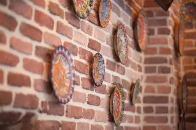 a wall with plates on a brick wall at La Vida Old City Hotel in Istanbul
