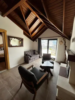 a living room with a couch and a table at Masklavi in Kestel