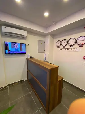 a reception room with clocks on the wall at Mina Life Hotel in Istanbul