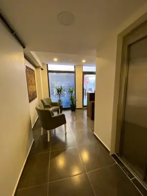 a lobby with a waiting room with chairs and a table at Mina Life Hotel in Istanbul
