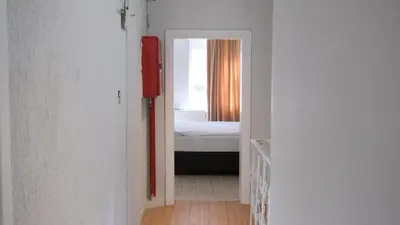 a hallway with a bedroom and a bed in a room at Simon Hotel in Istanbul