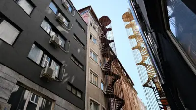 a building with a fire escape on the side of it at Simon Hotel in Istanbul