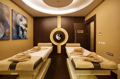 a room with three beds with a sign on the wall at Dedeman Bostanci Istanbul Hotel & Convention Center in Istanbul