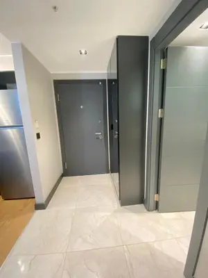a hallway with two doors and a tile floor at Central Modern Apartment by Siena Suites in Istanbul
