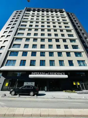 a car parked in front of a large building at Central Modern Apartment by Siena Suites in Istanbul
