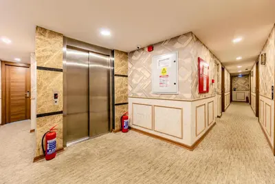 an empty hallway with a elevator in a building at Sultan Hamit Hotel in Istanbul