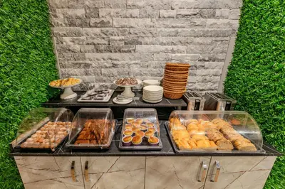 a buffet with various types of pastries and other foods at Sultan Hamit Hotel in Istanbul