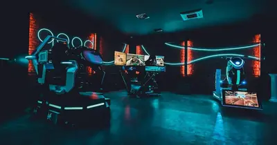 a room with a video game set up in a dark room at Mola İstanbul in Silivri