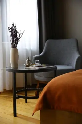a living room with a chair and a table at ROCO Beyoglu in Istanbul