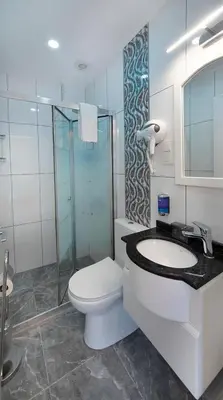 a bathroom with a toilet and a sink and a shower at Lika Hotel - Superior Double or Twin Room in Istanbul