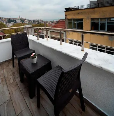 two chairs and a table on a balcony at Lika Hotel - Superior Double or Twin Room - unforgettable holiday in Istanbul in Istanbul