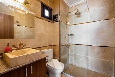 a bathroom with a toilet and a sink and a shower at The First Ottoman Dream in Istanbul