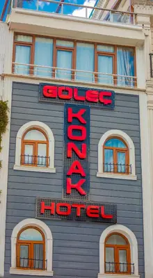 a blue building with a red hotel sign on it at Gülec Konak Hotel in Istanbul