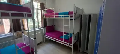 a room with two bunk beds and a window at XALİLA HOSTEL & CAFE, MEN's ROOM, BEST IN ISTANBUL , in Istanbul