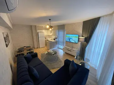 an overhead view of a living room with a blue couch at King Suite SS0 in Istanbul