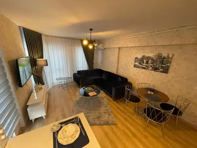 a living room with a couch and a table at King Suite SS0 in Istanbul