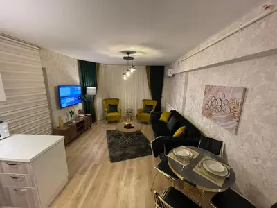 a living room with a couch and a table at King Suite SS4 in Istanbul