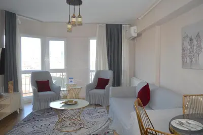 a living room with a couch and chairs and a table at King Suite SS18 in Istanbul
