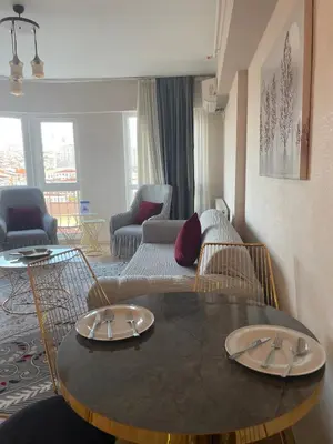 a living room with a table and a couch at King Suite SS18 in Istanbul