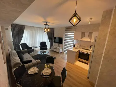 a living room with a couch and a table at King Suite AE4 in Istanbul