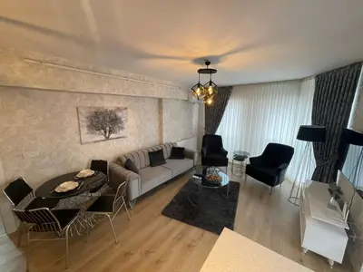 a living room with a couch and a table at King Suite AE4 in Istanbul