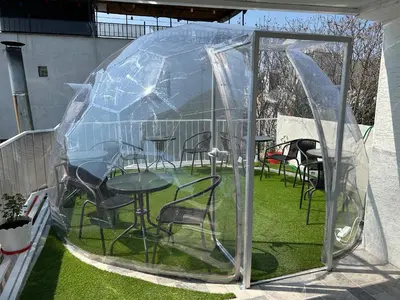 a gazebo with tables and chairs in it at HOTEL GLOBAL 2022 in Istanbul