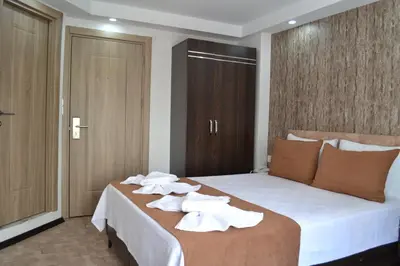a hotel room with a bed with towels on it at HOTEL GLOBAL 2022 in Istanbul